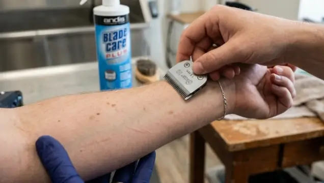 Performing the forearm test to check dog grooming clipper blade temperature